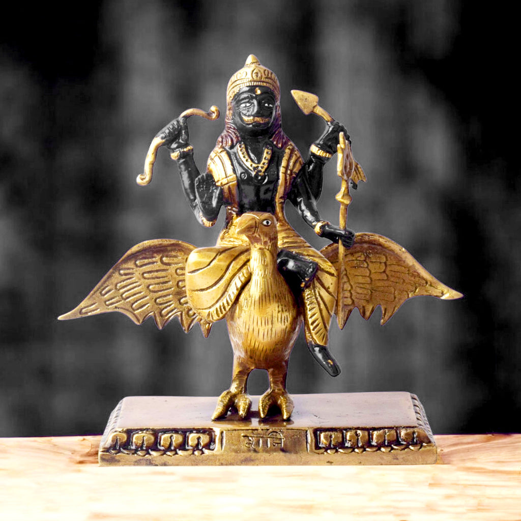  The 6.7 Inch Brass Shani Dev Idol Symbol of Justice and Protection is a beautifully crafted piece that embodies the powerful qualities of Shani Dev, the celestial deity of justice, discipline, and protection. Made from high-quality brass, this idol features Shani Dev in a detailed and commanding posture, symbolizing his ability to bring balance, fairness, and spiritual protection to those who seek his blessings. 