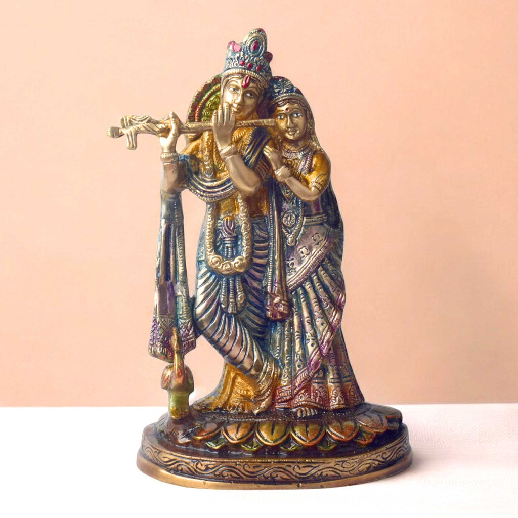 The 10 Inch Radha Krishna Idol for Your Altar is a stunning depiction of divine love and spiritual harmony. Crafted with exquisite attention to detail, this idol beautifully portrays Radha and Krishna in a graceful pose, with Krishna playing his flute and Radha radiating serenity and devotion.