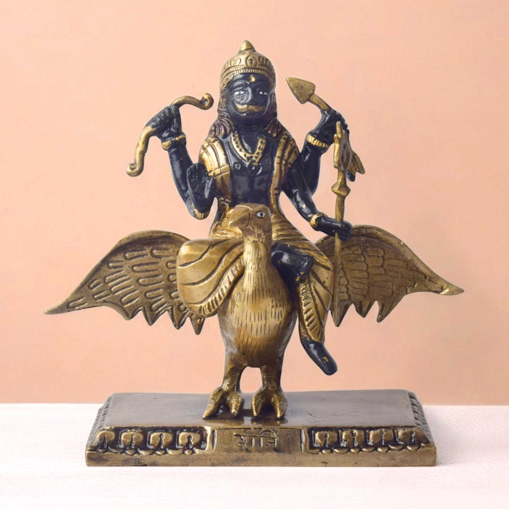  The 6.7 Inch Brass Shani Dev Idol Symbol of Justice and Protection is a beautifully crafted piece that embodies the powerful qualities of Shani Dev, the celestial deity of justice, discipline, and protection. Made from high-quality brass, this idol features Shani Dev in a detailed and commanding posture, symbolizing his ability to bring balance, fairness, and spiritual protection to those who seek his blessings. 