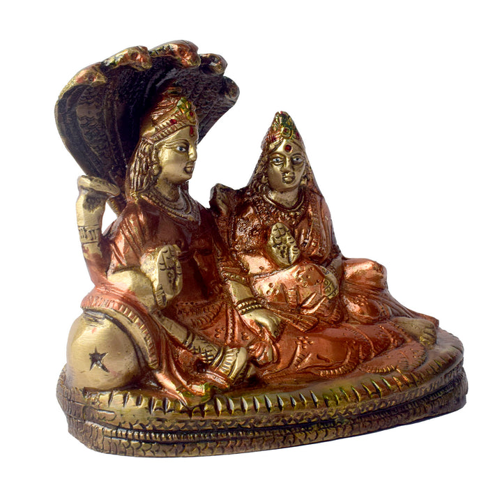  The 4.7 Inch Vishnu Ji Resting on Snake - Small Divine Figure is a beautifully crafted miniature statue that showcases Lord Vishnu in a serene and tranquil pose. Resting gracefully on the multi-headed serpent, Sheshnag, this divine figure symbolizes the eternal peace and protection Vishnu provides to the universe. 