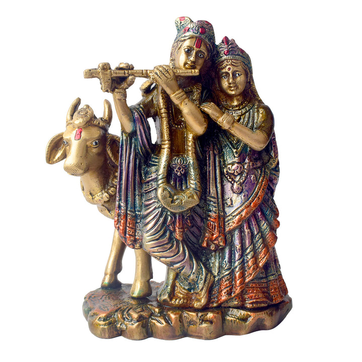 The 6.3 Inch Sacred Radha Krishna with Kamdhenu Cow Idol beautifully captures the divine union of Radha and Krishna, symbolizing love, harmony, and devotion. Crafted with intricate details, this idol features Radha and Krishna in an intimate and graceful pose, with Krishna playing his flute and Radha beside him, embodying the essence of their eternal bond.