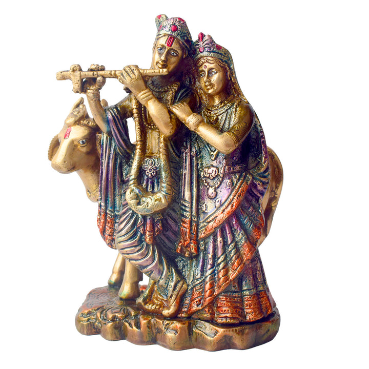 The 6.3 Inch Sacred Radha Krishna with Kamdhenu Cow Idol beautifully captures the divine union of Radha and Krishna, symbolizing love, harmony, and devotion. Crafted with intricate details, this idol features Radha and Krishna in an intimate and graceful pose, with Krishna playing his flute and Radha beside him, embodying the essence of their eternal bond.