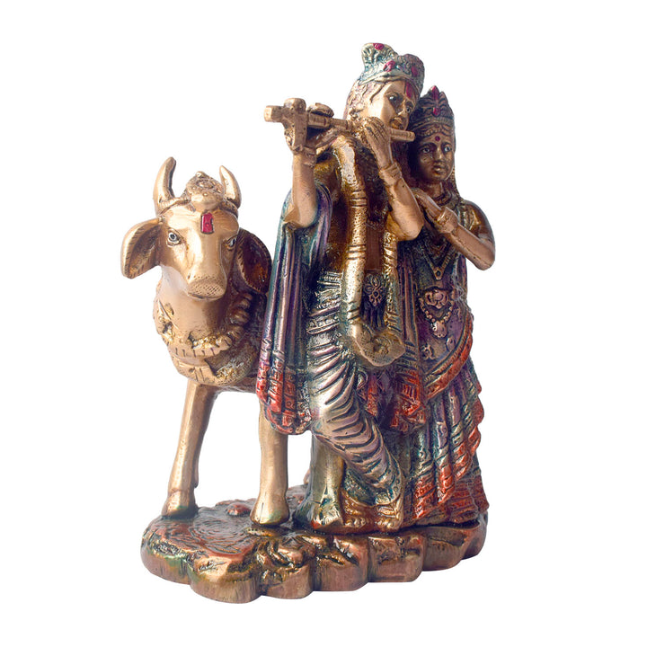 The 6.3 Inch Sacred Radha Krishna with Kamdhenu Cow Idol beautifully captures the divine union of Radha and Krishna, symbolizing love, harmony, and devotion. Crafted with intricate details, this idol features Radha and Krishna in an intimate and graceful pose, with Krishna playing his flute and Radha beside him, embodying the essence of their eternal bond.