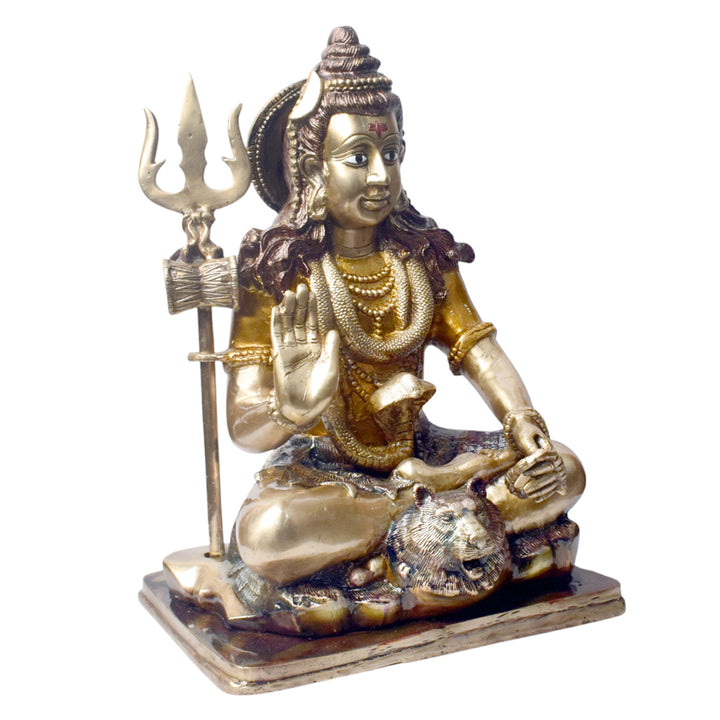 Embodying peace and spiritual focus, this 17.5-inch Brass Shiva Idol features Lord Shiva in a serene meditative posture. Known as the ultimate yogi, Lord Shiva is beautifully represented here with intricate detailing in brass, capturing the tranquility and profound wisdom of his meditation.