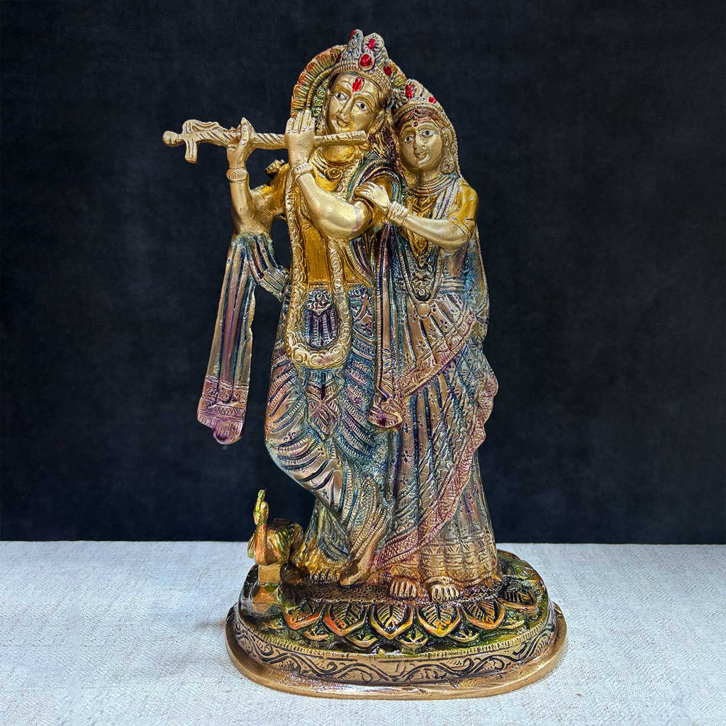 The 11.4 Inch Radha Krishna – Divine Harmony in a Sacred Sculpture is a breathtaking masterpiece that captures the eternal and divine bond between Radha and Krishna. This beautifully detailed idol showcases the couple in a serene and harmonious pose, with Krishna playing his mesmerizing flute and Radha standing gracefully by his side.