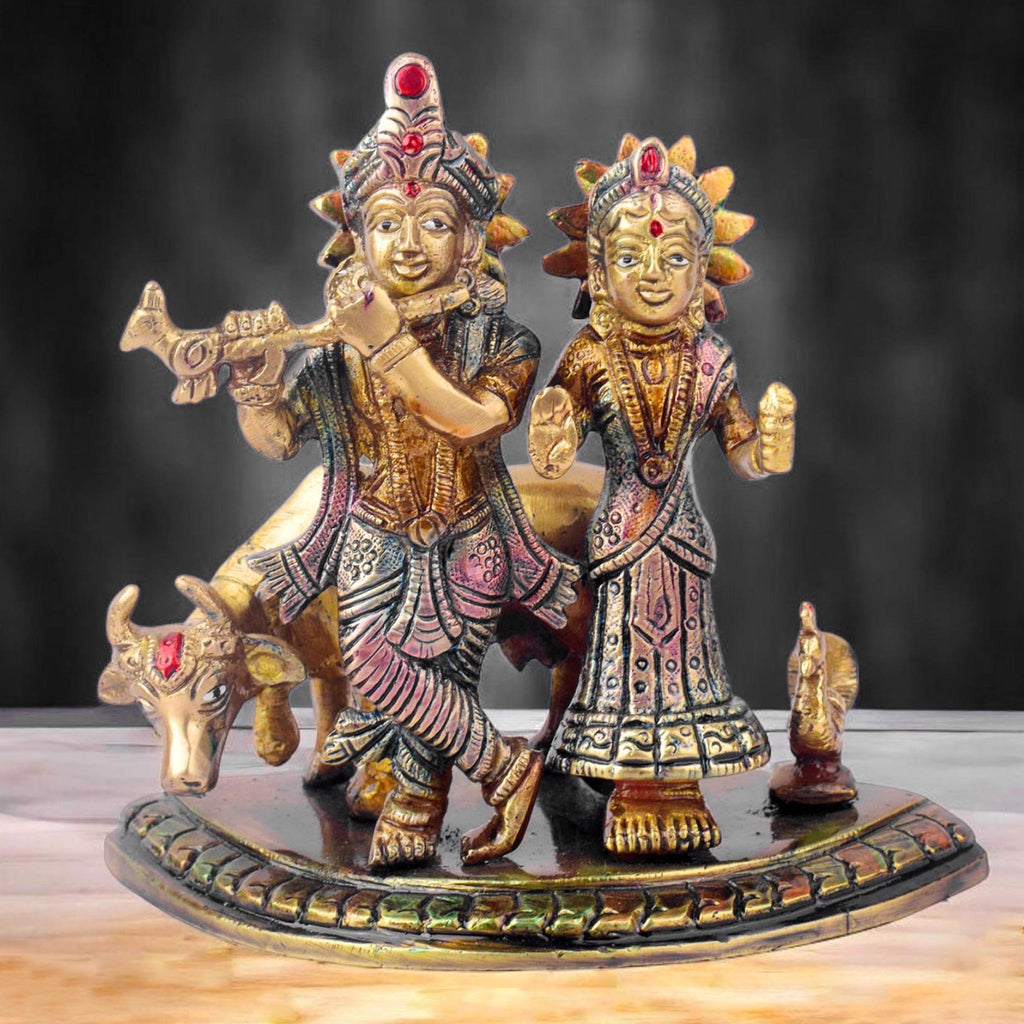  The 5.5 Inch Divine Radha Krishna with Kamdhenu Cow Idol is a captivating symbol of eternal love, harmony, and divine blessings. This beautifully crafted idol features Radha and Krishna in a serene pose, with Krishna playing his mesmerizing flute and Radha standing gracefully by his side. 