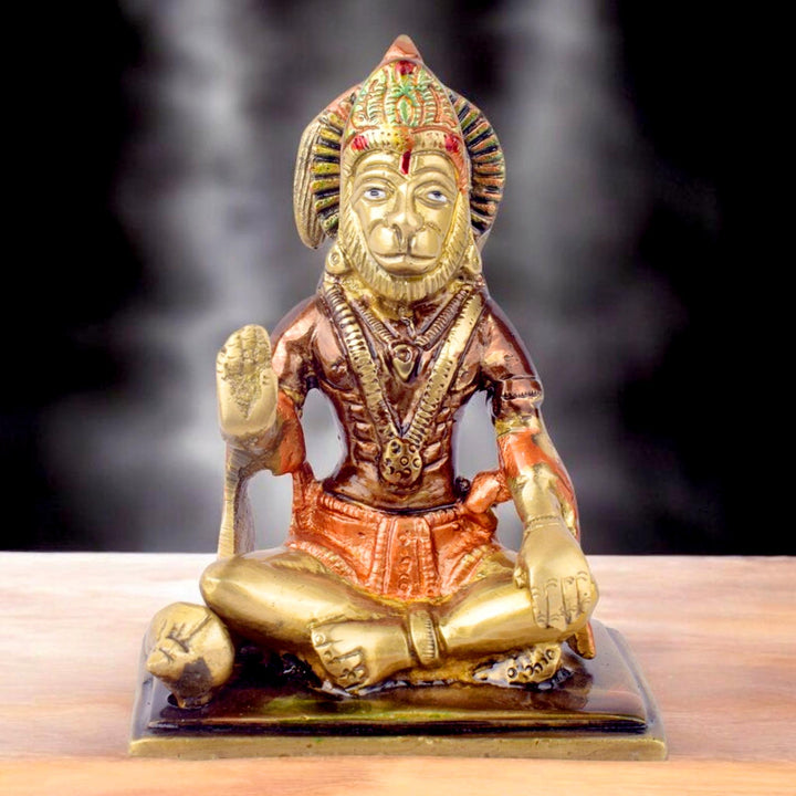 The "4.5 Inch Eternal Brass Hanuman Idol" is a finely crafted representation of Lord Hanuman, embodying strength, devotion, and divine protection. Standing at 4.5 inches tall, this compact yet striking idol is made from high-quality brass, showcasing intricate details that highlight Hanuman’s powerful form and serene expression